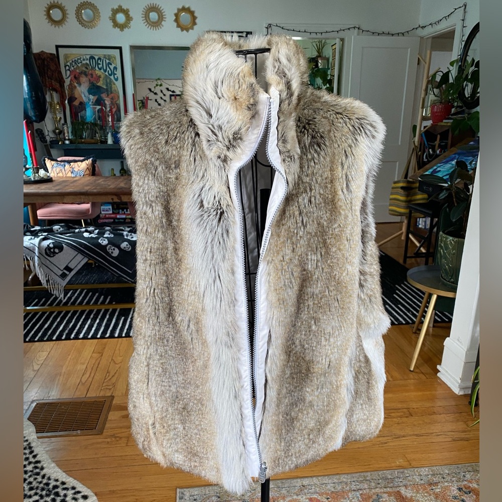 Reversible faux fur vest. White interior.
